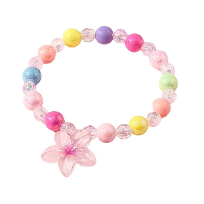 Pulsera de cuentas pastel y cristal facetado con un dije de flor rosa translúcida